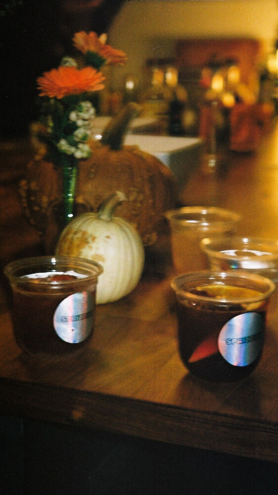 Dark red drinks in clear cups with holographic Sprizzini stickers